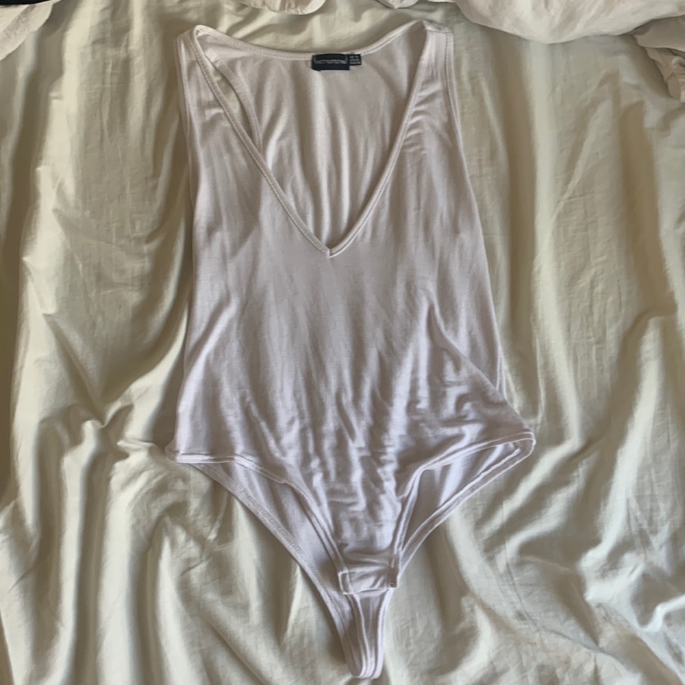 White one piece deep v neck line